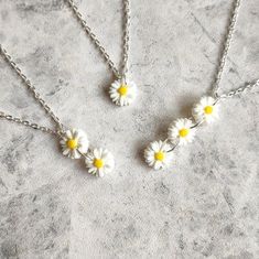 Feel as fresh as a daisy this Summer with my beautiful acrylic flower Collection! Featuring dainty little resin daisies, necklaces and earrings are available in single, double or triple drops! Daisy charms are handmade from super lightweight resin and measure 1.2cm each Single Daisy: 1.2cm drop Double Daisy: 2.5cm drop Triple Daisy: 3.8cm drop Choose your perfect number of daisies in either a necklace or earrings- or purchase together and save! Necklace length measures approx 16-18" and fastens Cute White Flower Jewelry, Cute White Jewelry With Flower Charm, Cute White Jewelry With 3d Flowers, Cute White Birth Flower Jewelry, Earrings Double, Daisy Charm, Acrylic Flower, Flower Collection, Daisy Necklace