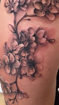 a woman's thigh with flowers on it