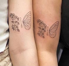 two people with matching tattoos on their arms, one has a butterfly and the other has flowers