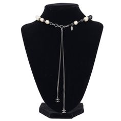 Authentic, pre-owned Chanel Pearl Bead Long Necklace. Features a beautifully detailed Coco Pearl Bead Enamel CC Baroque Long Necklace. This elegant extra long necklace features smooth glass beads, resin baroque pearls, and a textured pendant with a CC logo. This necklace can be worn long or short as shown. Chanel stamp is present and pictured. Rare. Chain: 22" with lobster clasp Marked: A11P Made in 2011 Made in France Luxury Beaded Long Necklace, Elegant Pearl Necklace With Round Beads And Chain, Luxury Long Beaded Chain Necklace, Elegant Beaded Lariat Necklace, Luxury Pearl Chain Necklace With Round Beads, Luxury Necklace With Pearl Chain And Round Beads, Luxury Pearl Necklace With Polished Beads, Luxury Necklaces With Faceted Beads For Jewelry Making, Luxury Beaded Necklace With Round Beads