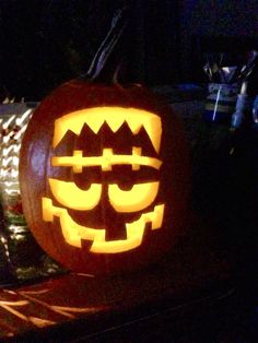 a carved pumpkin sitting on top of a table