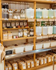 the shelves are filled with many different types of items and containers for sale on them