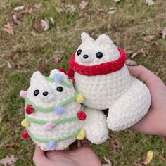 two crocheted stuffed animals are held in the palm of someone's hand