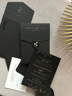 black and white wedding stationery with gold foiling on the front, back and inside