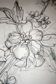 a drawing of some flowers on a white paper