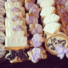 some decorated cookies are sitting on a table