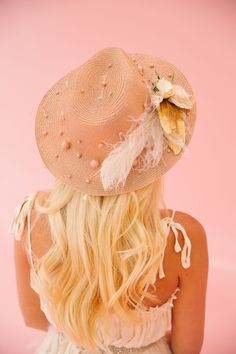 Shade yourself in unique style with the GOLDEN FLOWERS SUN HAT. This golden hat features elegant pearls, chic gold and cream feathers, delicate white flowers, and a playful horseshoe pin. Perfect for any Derby event or to simply add a touch of glamour to your look! This hat is ONE OF A KIND, created by our owner Stephanie. To receive item quicker, expedited shipping is available at checkout. Rancher Hat, Cream Dress, Sun Hat, Sun Hats, The Golden, White Flowers, Derby, Feathers, Unique Style