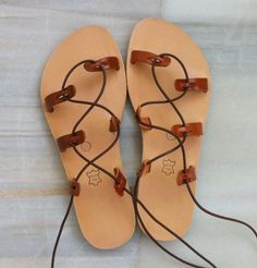 Summer Strapped Leather Lace-up Sandals, Leather Straps Sandals For Summer, Leather Strapped Sandals For Summer, Brown Strapped Sandals For Summer, Brown Strap Sandals For Summer, Brown Strappy Sandals For Summer, Brown Strappy Barefoot Sandals, Brown Strapped Sandals For Beach, Brown Leather Summer Lace-up Sandals