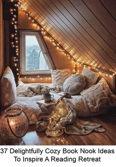 there is a bed with lights in the attic and pillows on the floor next to it