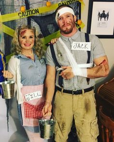 a man and woman dressed up in costumes for a halloween party with caution tape on their heads