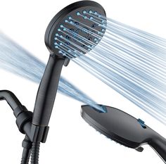 an image of a shower head with water coming out of it and hose attached to it