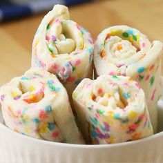 a bowl filled with cake rolls covered in sprinkles