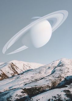 an artist's rendering of saturn and its rings in the sky over snowy mountains