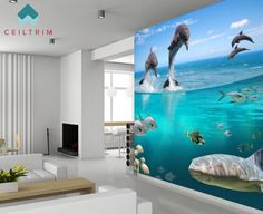 the dolphins are swimming in the ocean with fish on it's back wall mural