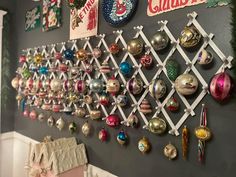 christmas ornaments are hanging on the wall