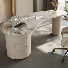 a white desk with a laptop on it in front of a window and a chair