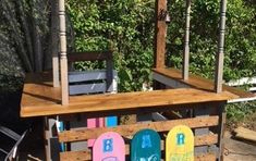 a wooden cart with surfboards painted on it