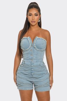 This unique garment blends classic denim charm and a modern corset layout, offering a sweetheart neckline and structured bodice. The frayed edges add edgy charm, while the button-front detail adds to its retro feel. Made from high-quality denim with a hint of stretch, this romper guarantees both comfort and a flattering fit. Wear it with strappy heels and daring accessories for a laid-back outing or a chic evening occasion. Exude confidence and leave a lasting impression with this versatile and stylish romper. Fitted Denim Jumpsuit For Party, Denim Blue Strapless Spring Corset, Strapless Denim Blue Corset For Spring, Spring Denim Blue Strapless Corset, Fitted Strapless Denim Jumpsuit In Blue, Fitted Strapless Denim Blue Jumpsuit, Strapless Fitted Denim Blue Corset, Denim Blue Fitted Strapless Corset, Fitted High Waist Denim Blue Corset