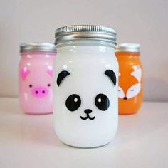 three mason jars with painted animals on them