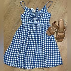 Adorable!! Nwt Old Navy Gingham Blue And White Sundress, With Front Tie Peek-A-Boo Key Hole. Hits Just Above Knee, Size Small, Adjustable Straps And Gathered Elastic Back Panel. Gingham Cotton Mini Dress For Beach, Gingham Cotton Mini Dress For The Beach, Blue Cotton Mini Dress For Picnic, Casual Gingham Dress For Day Out, Casual Mini Dress For Picnic, Casual Gingham Mini Dress For Vacation, Casual Gingham Cotton Mini Dress, Blue Cotton Sundress For Picnic, Casual Gingham Mini Dress For Day Out