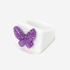 Take this ring for a spin! This chunky resin ring features a glittery purple butterfly that you can fidget with and rotate throughout the day to help keep you calm and focused. Sizes Available: 7, 8, 9 Finish: White, Purple Material: Plastic - Claire's Purple Butterfly Fidget Resin Ring Fidget Ring Butterfly, Cool Scrunchies, 00s Style, Purple Acrylic, Acrylic Ring, Fidget Rings, Fashionable Jewelry, Chunky Rings, Resin Ring