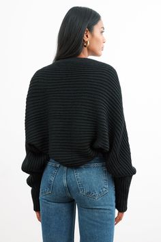 Our Vandam Knit Cardigan offers the coziness of a sweater combined with the minimalist silhouette of a bolero. Featuring an open front and long sleeves that skim over the shoulders, she's knit from thick rib French merino wool blend yarn, adding softness to her modern shape. Slip her on over tops and dresses and they'll receive an instant seasonal update—you'll enjoy the look and the all-day comfort![SPLIT] Palak, in black, is 5'9.5" (176.5 cm) tall, wearing size XS. Julia, in olive, is 5'10" (1 Streetwear Spring, Black Knit Cardigan, Spring Break Outfit, Minimalist Silhouette, Boho Aesthetic, Cardigan Outfits, Spring Fashion Trends, And Dresses, Chunky Sweater