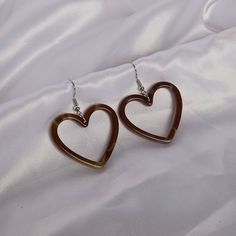 Don't miss out on these beautiful brown resin heart earrings. They work with a large variety of looks and add a bit of sparkle to your outfit. MORE jewellery pieces available on our shop! Any questions please message we are happy to help. Free postage in UK Thank you for shopping with us Heather&Bumble 📪Follow us at: Instagram: heatherandbumble Twitter: Heather_Bumble Pintrest: Heather & Bumble Brown Resin Heart Earrings - Resin Earrings,Brown Heart Earrings,Resin Heart Earrings In The UK,Brown Earrings In The UK,Brown Jewellery Brown Earrings Aesthetic, Valentine's Day Brown Heart Charm Jewelry, Brown Outfits, Brown Heart, Quinceanera Planning, Brown Earrings, Earrings Aesthetic, Brown Jewelry, Bride Jewelry