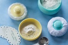 there are three different types of baking supplies on the table with one measuring cup, spoon and two cookie cutters