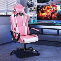 a pink and white office chair sitting in front of a desk with a computer monitor