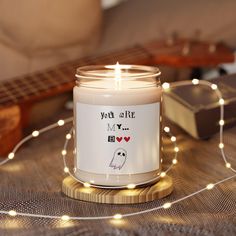 a candle with a sticker that says you're all my love on it