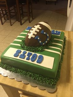 a football themed birthday cake on a table