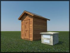 a small wooden outhouse sitting in the middle of a field next to a beehive