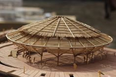 a wooden structure sitting on top of a table