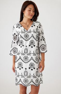 Build out your black-and-white collection with a winsome dress decorated in dainty eyelet and finished with a sweetly scalloped hem. 38" length (size Medium) Slips on over head V-neck Three-quarter sleeves Cotton lining 100% cotton Dry clean or hand wash, line dry Imported Elegant Cotton Dress With Scalloped Edges, White Cotton Dress With Scalloped Lace, Cotton Knee-length Dress With Embroidered Hem, Spring V-neck Cotton Embroidered Dress, White V-neck Kaftan With Floral Print, White Floral Print V-neck Kaftan, Cotton Floral Print Mini Dress With V-neck, Karen Kane, Eyelet Dress