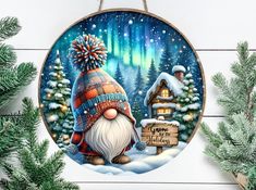 a christmas ornament hanging on a wall next to evergreens and pine trees