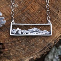 “Silver Landscape” Artwork Artsy Sun Mountainscape Mountain Ridge Bohemian Hippie Nature Climb Hike Ski Snowboard Elevated Elegant Classy Horizontal Silver Stainless Steel Necklace. Beautiful Art Imagery For Your Neck! A Horizontal Silver Textured Mountain Landscape With A Hollow Background Above The Mountains And A Silver Frame. On A Link Chain. Stainless Steel. Anti-Tarnish! Hypoallergenic. Lead & Nickel Free. New. *See Also “Golden Landscape” Listing. Measurements: Pendant Length: 0.5” Pendan Etched Jewelry, Free People Jewelry, Ceramic Handmade, Mens Jewelry Necklace, Jewelry Picture, Tree Necklace, Antique Necklace, Simple Necklace, Stainless Steel Necklace