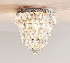 a chandelier hanging from the ceiling in a room