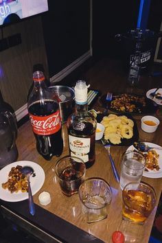 an assortment of food and drinks on a table