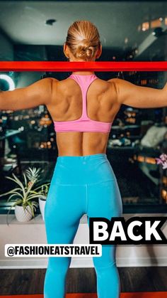 the back of a woman's body is shown in blue tights and pink sports bra