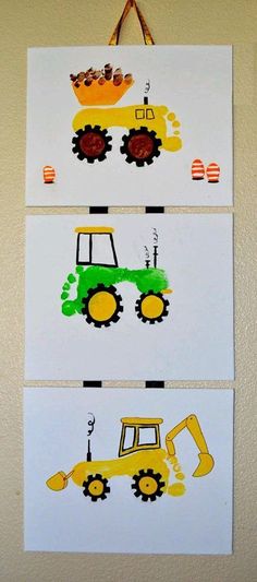 three pictures with construction vehicles painted on them hanging from the wall in front of a door