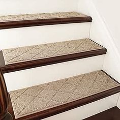 a set of carpeted stairs in a house