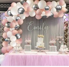 a pink and silver birthday party with balloons