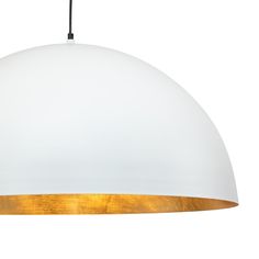 a white and gold pendant light hanging from a ceiling