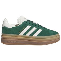 Bring on the nostalgia with the iconic adidas Originals Gazelle Bold. Constructed with a buttery soft suede upper, these classic silhouettes provide a durable feel and comfy fit that lasts long. The synthetic lining offers superior warmth, while the three-layered stacked height provides a new perspective on the classic style. Finished with a metallic-gold 'Gazelle' and the iconic serrated 3-Stripes, the adidas Originals Gazelle Bold makes heads turn no matter where you take them. adidas Original Adidas Suede Skate Shoes With White Sole, Adidas Suede Sneakers, Low-top Suede Sneakers With Three Stripes, Suede Low-top Sneakers With Three Stripes, Gazelle Bold, Adidas Originals Sneakers, Adidas Originals Gazelle, Heeled Rain Boots, High Heel Rain Boots