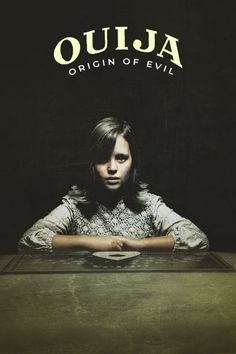 a woman sitting at a table in front of a black background with the words ouja origin of evil