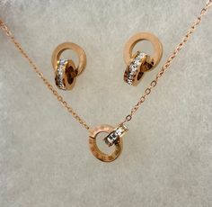 Elevate your style with sophistication and symbolism! Our Rose Gold Cubic Zirconia Infinity Roman Numbers Necklace and Earings isn't just jewelry; It's a declaration of timeless elegance and infinite possibilities. Let each Roman number represent a cherished moment, and the sparking cubic zirconia infuses your days with glamor. Indulge in luxury, embrace eternal beauty, and make a statement without hesitation. Elevate your every day because you deserve to shine endlessly.  NECKLACE Daily wear an Gift Jewelry Sets With Clavicle Chain, Rose Gold Metal Jewelry Set For Gift, Rose Gold Jewelry Sets For Gifts, Elegant Stainless Steel Jewelry Sets As A Gift, Gold Stainless Steel Jewelry Sets As Gift, Elegant Stainless Steel Jewelry Sets For Gift, Elegant Rose Gold Jewelry Sets For Mother's Day, Formal Stainless Steel Jewelry For Valentine's Day, Rose Gold Jewelry Set