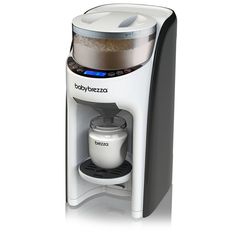 a white coffee maker sitting on top of a counter