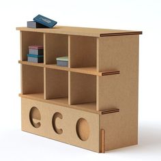 a cardboard book shelf with books on it