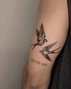 two birds with roman numerals on their arm and the word xxivix written in black ink