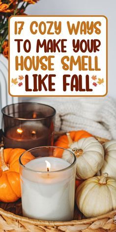 a basket filled with candles and pumpkins next to a sign that says 17 cozy ways to make your house smell like fall